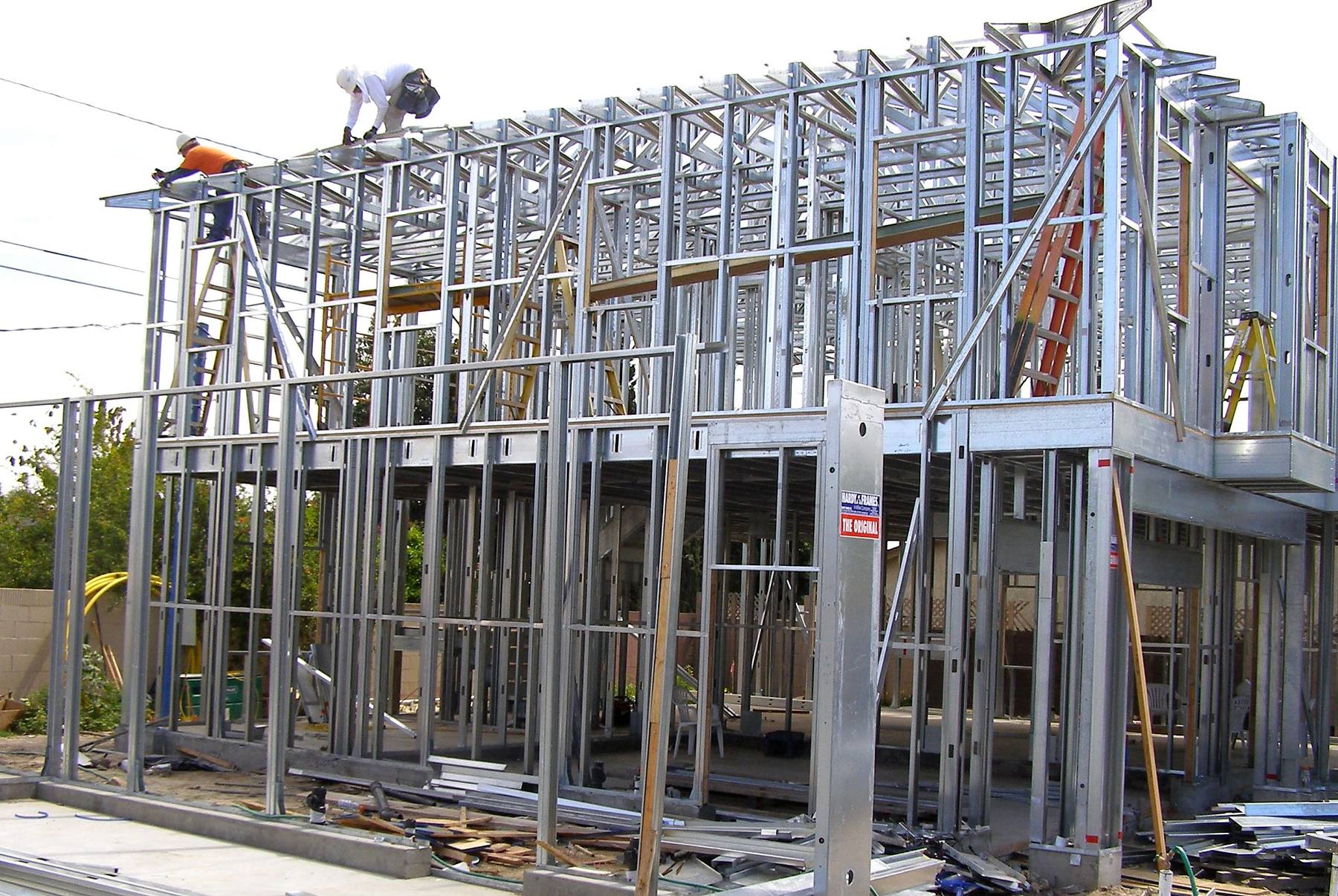 Multi-story residential structure under construction with cold-formed steel framing.