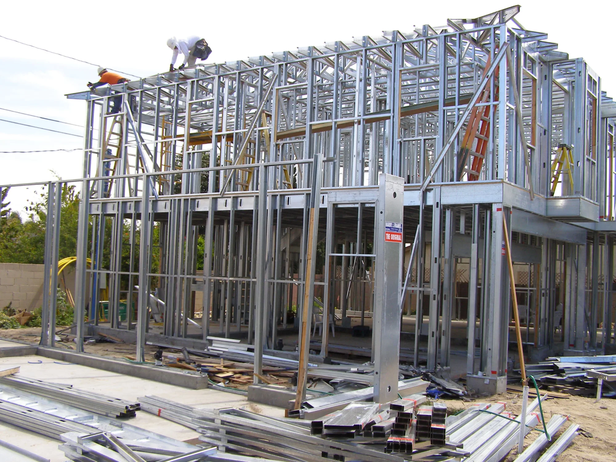 Residential cold-formed steel framing with broad construction site context