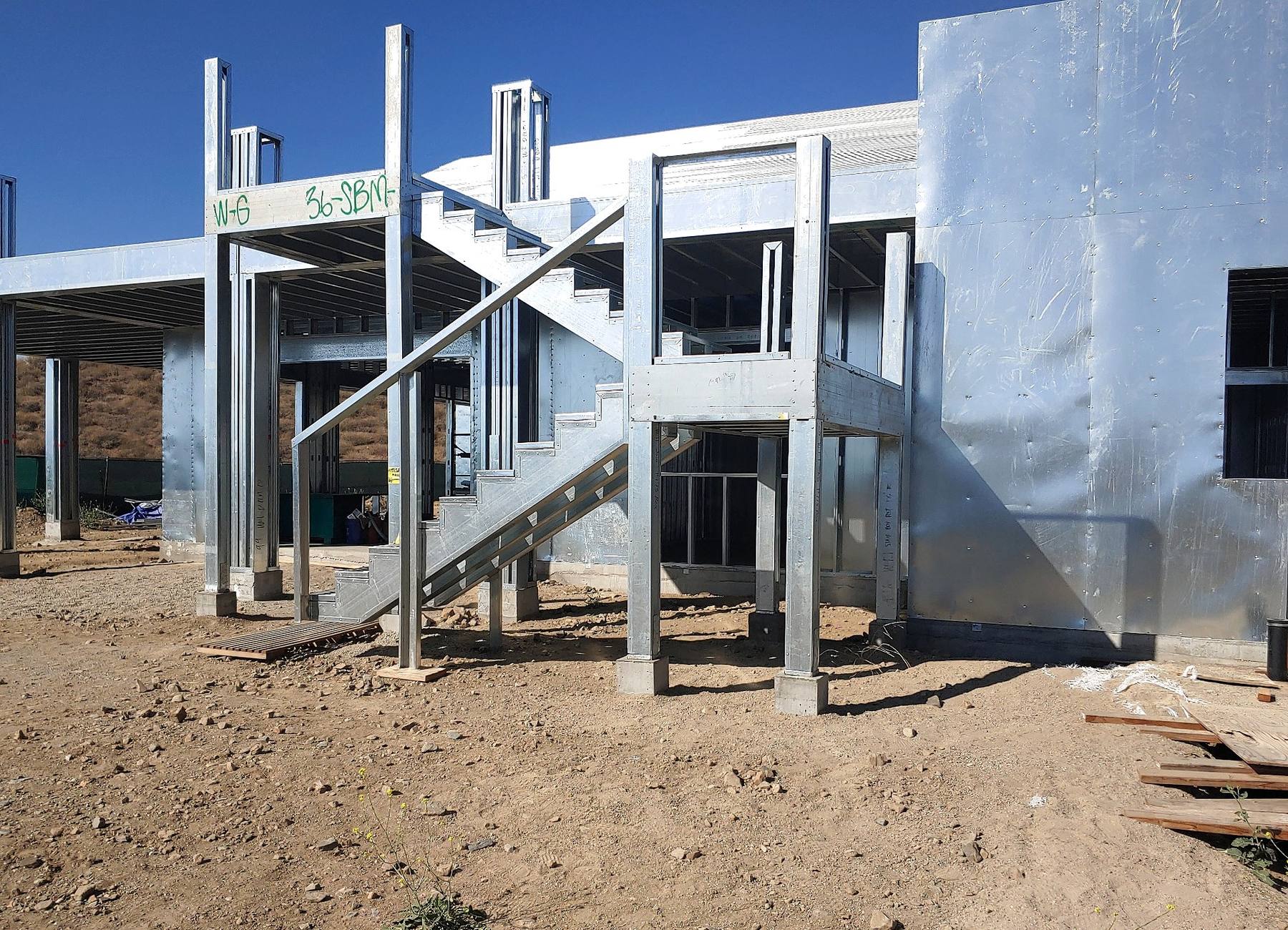 Custom residential steel stair and surrounding cold-formed steel framing.